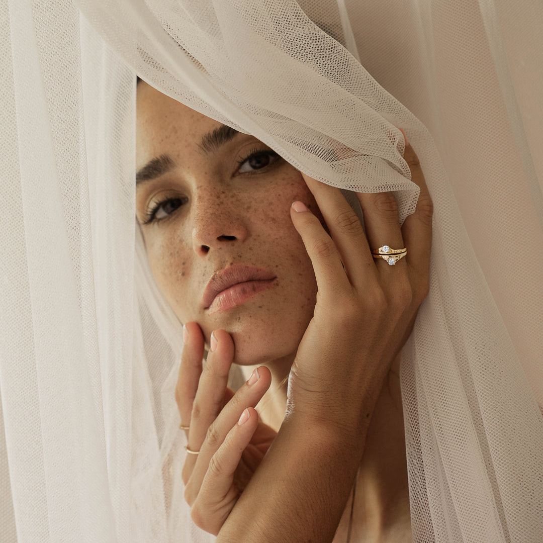 A woman wearing Ienissei rings by ScÃ©ona fine jewellery